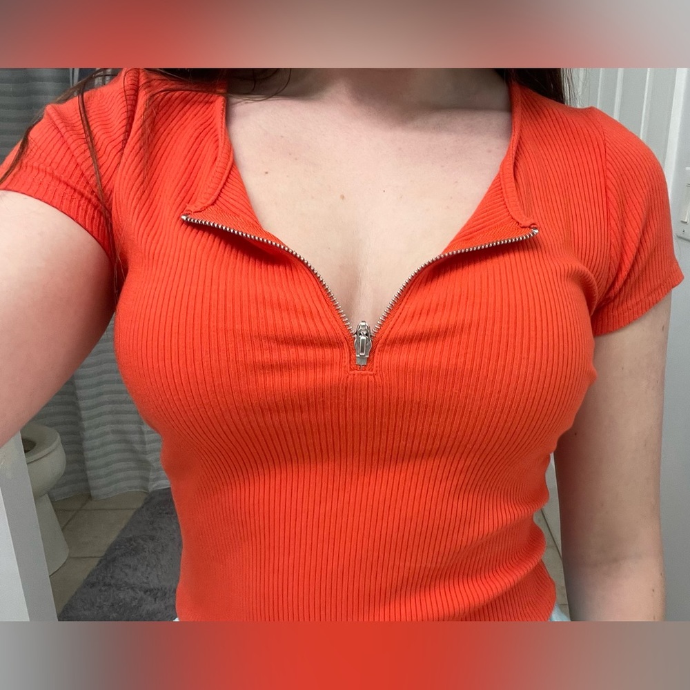 Garage Medium orange top, in perfect condition.